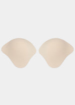 Still front product view of the latte-colored Ultimate Invisibles adhesive bra cups, showcasing the two separate lightweight cups with a smooth outer finish and skin-friendly adhesive lining for a seamless, invisible look.