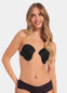 Front view of a model wearing the Ultimate Invisibles adhesive bra cups, showcasing the lightweight, backless and strapless design with two separate smooth cups that create natural-looking cleavage and an invisible finish under clothing.