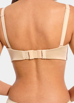 Back view of a model wearing a bra with a latte Bra Extender attached, showing how the extension piece adds extra length to the band for a more comfortable and adjustable fit.