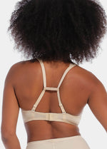 Back view of a model demonstrating different ways to use the Magic Straps, showing how the soft fabric clips pull bra straps together to create a racerback effect and prevent slipping. The image highlights multiple styling options and the discreet fit under clothing.