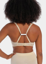 Back view of a model demonstrating different ways to use the Magic Straps, showing how the soft fabric clips pull bra straps together to create a racerback effect and prevent slipping. The image highlights multiple styling options and the discreet fit under clothing.