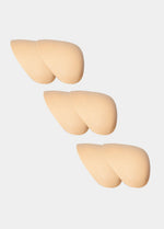 Three beige shoulderpads on a white background