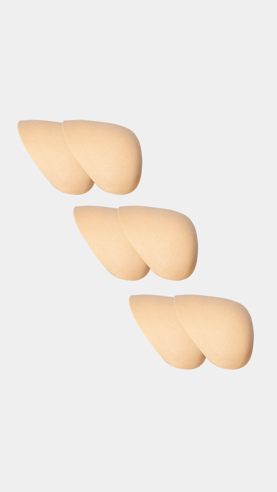 Three beige shoulderpads on a white background