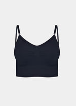Still front product view of the black Bamboo Low Back Bra, highlighting the seamless, wireless design in soft bamboo fabric with built-in support, removable inlay pads, and adjustable spaghetti straps.