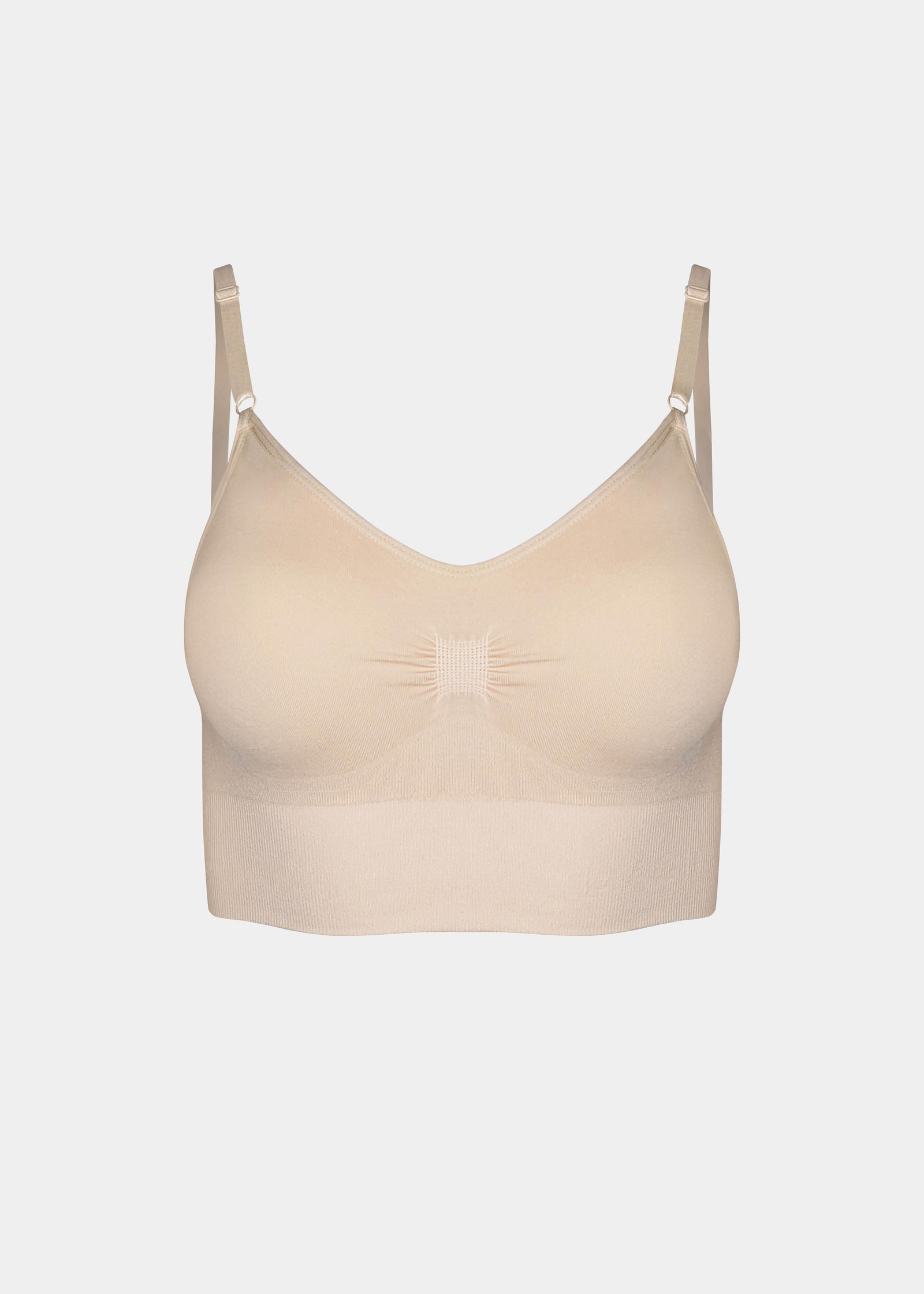 Still front product view of the latte-colored Bamboo Low Back Bra, highlighting the seamless, wireless design in soft bamboo fabric with built-in support, removable inlay pads, and adjustable spaghetti straps.