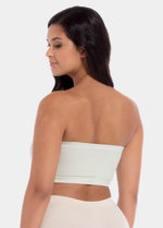 Back view of a model wearing the soft green Bamboo Bandeau Bra, showcasing the seamless, strapless design in smooth bamboo fabric with a clean, comfortable finish.