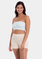 Front view of a model wearing the soft blue Bamboo Bandeau Bra, featuring a strapless, wireless design in ultra-soft bamboo fabric with removable pads and a smooth, seamless fit.