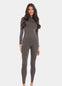 Front view of a model wearing the chocolate-colored Bodycon Jumpsuit, featuring a full-length, long-sleeved seamless design with soft, stretchy fabric that hugs the curves and provides flattering bust support.