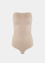 Still front product view of the latte-colored Bandeau Thong Body, highlighting the seamless bandeau neckline with silicone trim, built-in bust support, medium shaping through the waist and tummy, and a smooth, wireless finish.