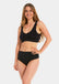 Front view of a model wearing the black Comfort Thong, featuring soft, seamless fabric with light shaping support and a smooth, invisible finish under clothing.