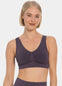 Woman wearing a dark purple Bamboo Comfort Bra and leggings on a white background