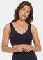 Woman wearing a navy blue Bamboo Comfort Bra and leggings on a white background