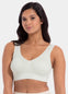 Woman wearing a light green Bamboo Comfort Bra against a white background