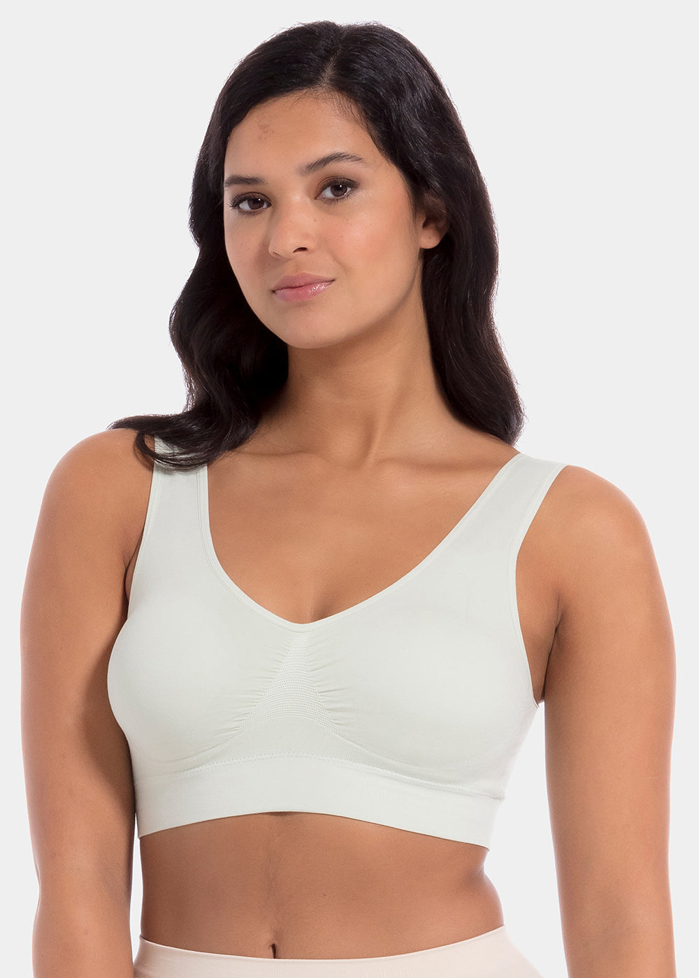 Woman wearing a light green Bamboo Comfort Bra against a white background