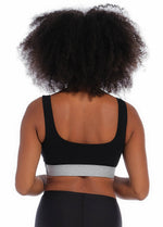 Back view of a model wearing the Salsa Bra, showcasing the smooth, seamless back design with wide supportive straps and a clean, wireless finish for all-day comfort.
