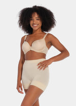 A person wearing a black comfort short that reaches mid-thigh, made of a smooth, solid fabric.