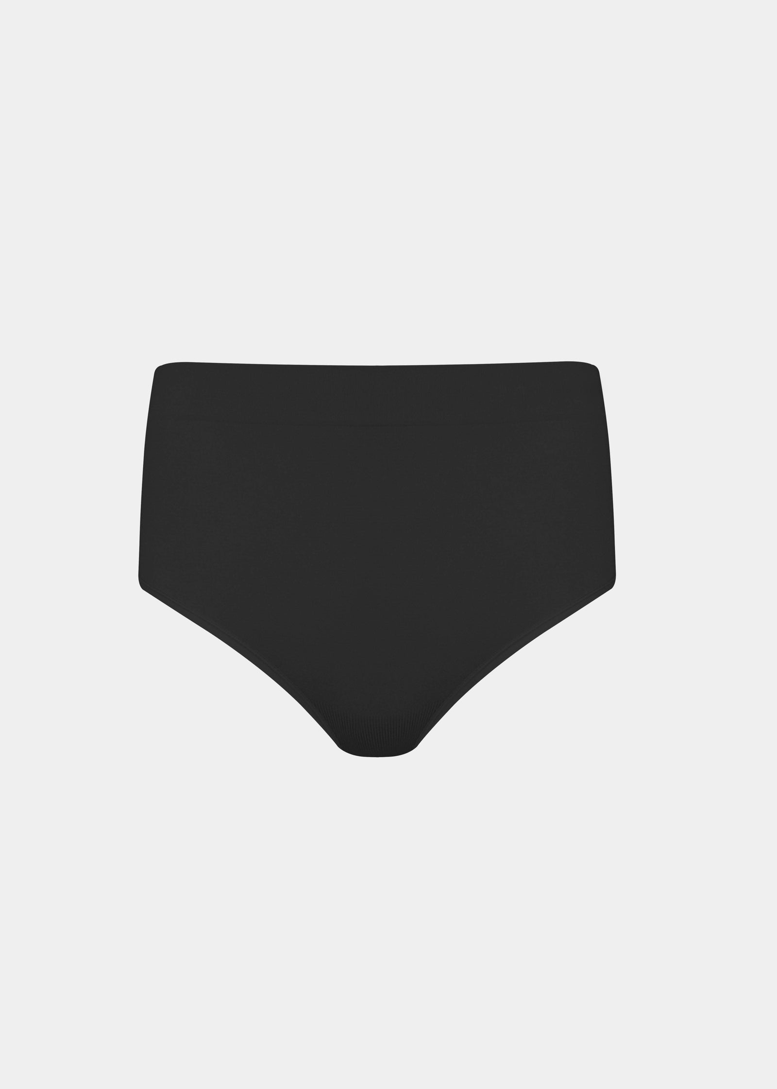 Still back product view of the black Comfort Thong, highlighting the seamless, lightweight fabric, smooth edges, and minimal design for a clean, invisible finish.