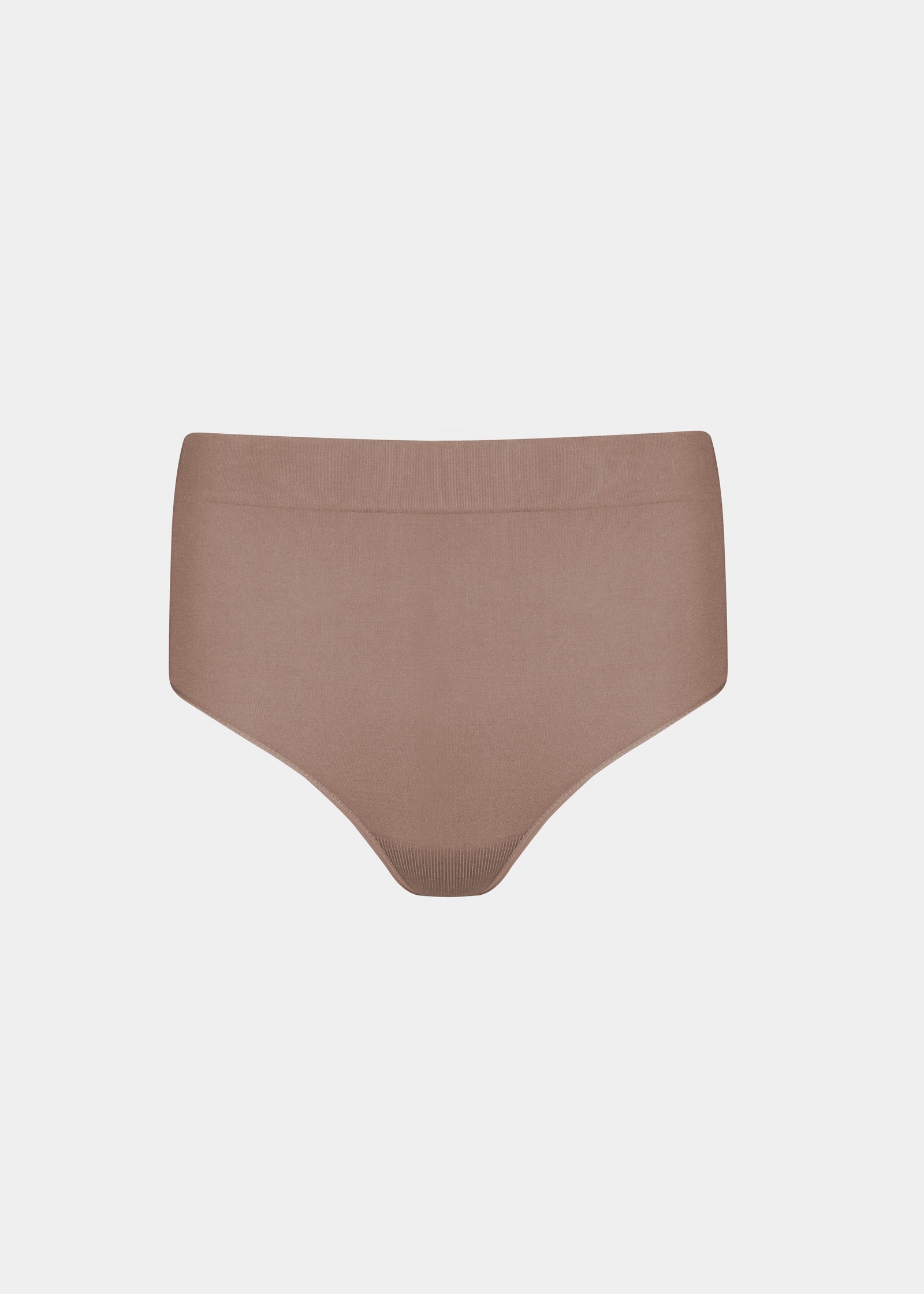 Still front product view of the macchiato-colored Comfort Thong, showcasing the soft, seamless fabric, smooth waistband, and minimal design for an invisible look under clothing.