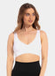 Front view of a model wearing a white Comfort Plunge Bra made from soft, seamless fabric. The wireless bra features a deep V-neckline for a flattering cleavage, wider supportive straps, and a smooth, closure-free back for a clean, comfortable fit.