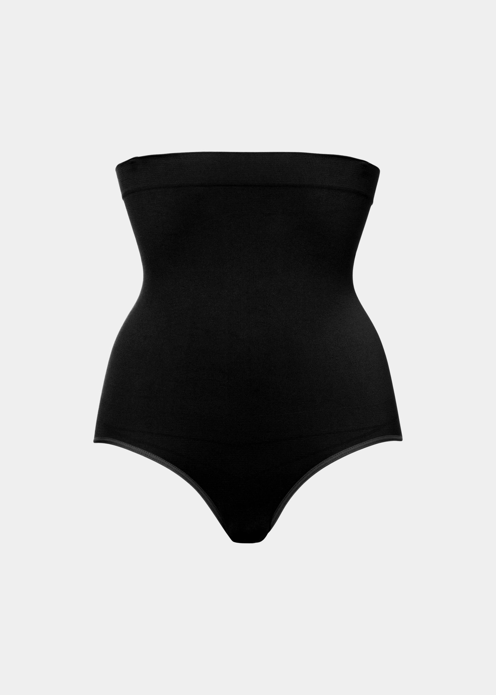 Still front view of a model wearing the black Comfort Waistnipper Brief, highlighting the high-rise waistband, smooth seamless fabric, and flattering tummy-smoothing design with an invisible finish under clothing.