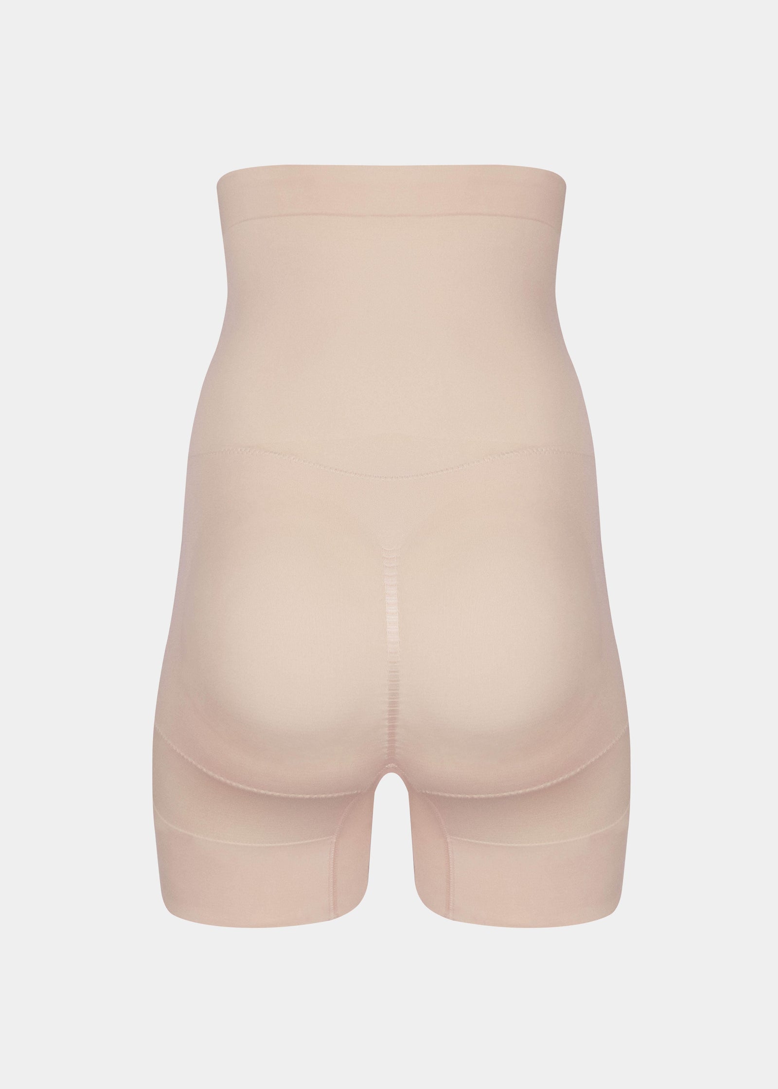 Back product view of the latte-colored high-waisted seamless shaping shorts, highlighting the lift-enhancing design, smooth seamless fabric, and clean leg openings for an invisible finish.