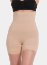 Front product view of the latte-colored high-waisted seamless shaping shorts, highlighting the smooth tummy-control panel, high-rise waistband, and seamless, invisible finish at the leg openings.