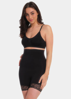 A model wearing high-waisted black shorts with lace details on the legs.