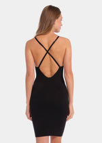 A model wearing a low back, low front dress with spaghetti straps and a skirt length. (back view)