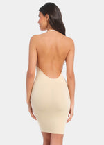 A model wearing a latte low back, low front dress with spaghetti straps and a mini skirt length. (back view) straps used differently