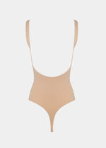 Beige swimsuit with thin straps on a light gray background