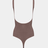 Brown body with thin straps on a light gray background