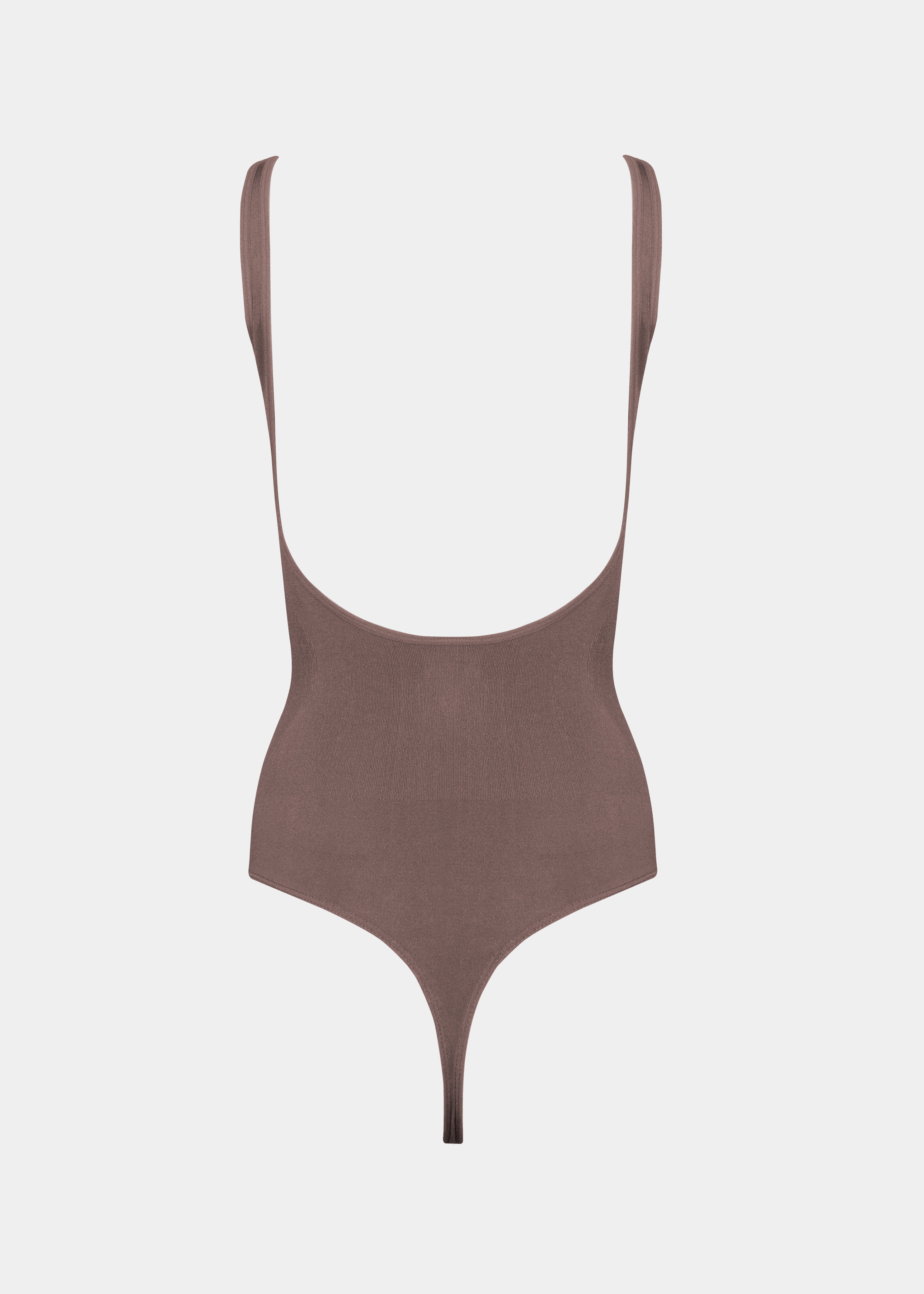 Brown body with thin straps on a light gray background