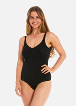 Woman wearing a black swimsuit on a white background