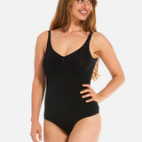 Woman wearing a black swimsuit on a white background