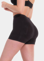 Person wearing black Booty Booster Short on a white background