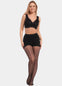 Front view of a model wearing Sexy Dots shaping tights in black, 20 denier sheer tights with trendy dot pattern. Built-in firm shaping shorts provide control for tummy, hips, and upper legs, with subtle lift at the bottom and reinforced toes visible.
