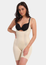 A model wearing the Latte Dream Shaper Dress with a strapless design and a seamless finish.