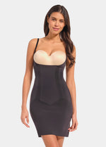 A woman wearing a Dream Shaper Dress with a strapless design and a seamless finish.
