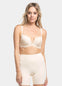 A person wearing a beige Dream Shaper Short that reaches mid-thigh, designed for shaping the lower back, tummy, and upper legs.