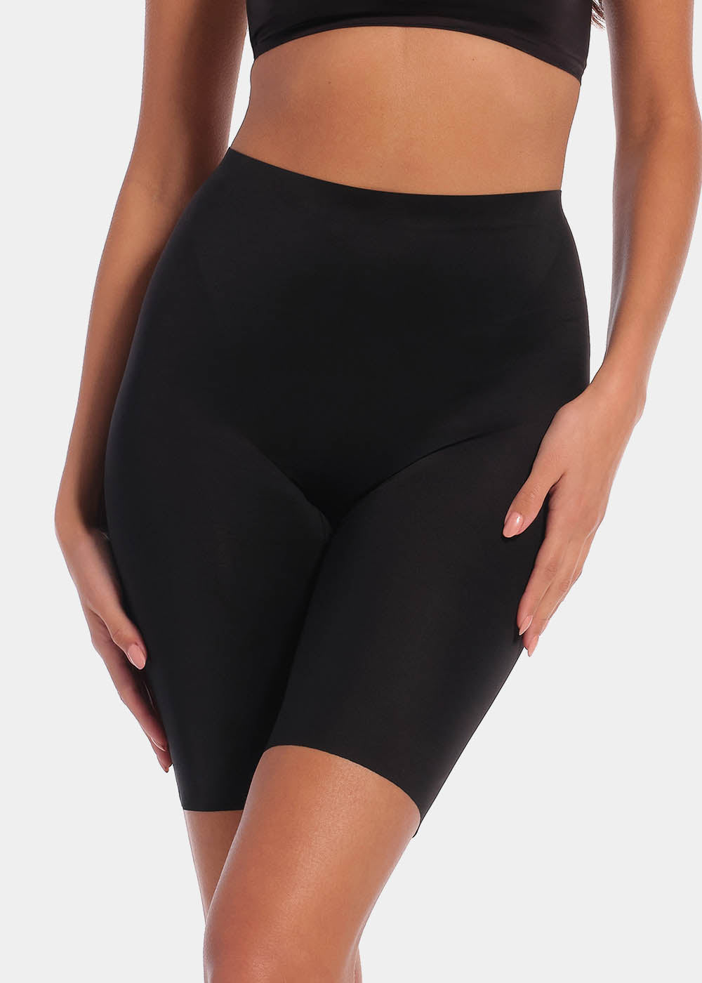 A pair of black, satin-look medium-rise Gloss Biker Short with a smooth, stretchy fabric. 