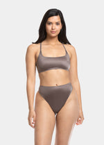 This image features the Gloss Scoop Bra, designed with elegance and comfort in mind. The bra top, presented in a soft, muted color, boasts a smooth satin finish that enhances its luxurious appeal.