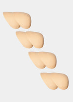 Set of four beige silicone shoulderpads on a white background