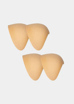 Set of beige shoulderpads on a white background
