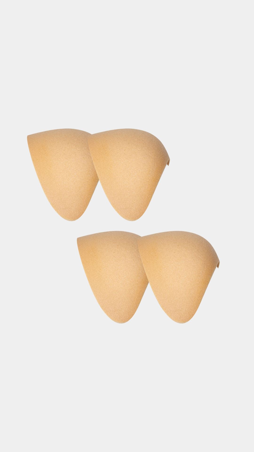 Set of beige shoulderpads on a white background