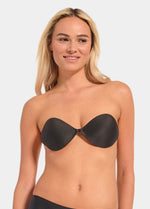 A woman wearing a black Backless Beauty adhesive bra.