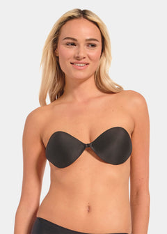 A woman wearing a black Backless Beauty adhesive bra.