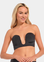Woman wearing a black strapless LUve Bra against a plain background
