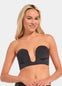 Woman wearing a black strapless LUve Bra against a plain background