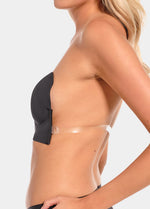 Partial view of a person wearing a black LUve Bra and clear sidestraps on a light gray background