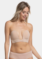 Woman wearing a caramel strapless LUve Bra and underwear on a greyish background